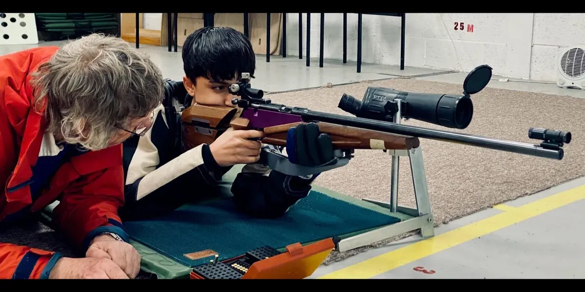 Beginner being coached at Pinhoe TSC's firing line during a Give it a Go session.
